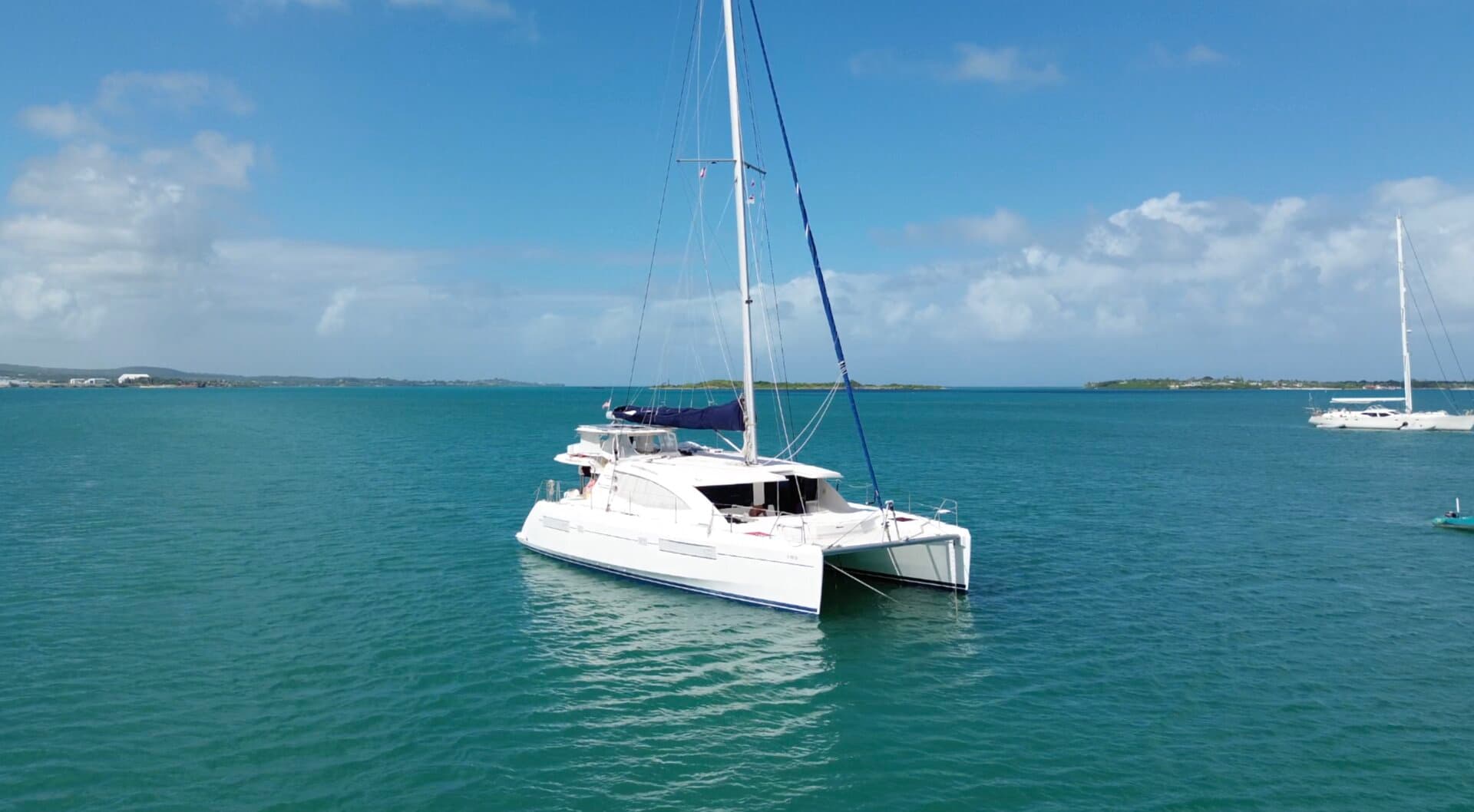 Our Leopard 48 catamaran at anchor in turquoise water